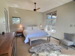 Queen suite bedroom with private porch and hot tub access